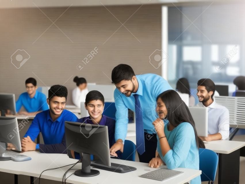 group of students with teacher in computer lab classrom learrning lessons,  get help and support