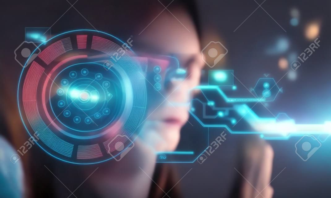 Young woman looking at virtual graphics