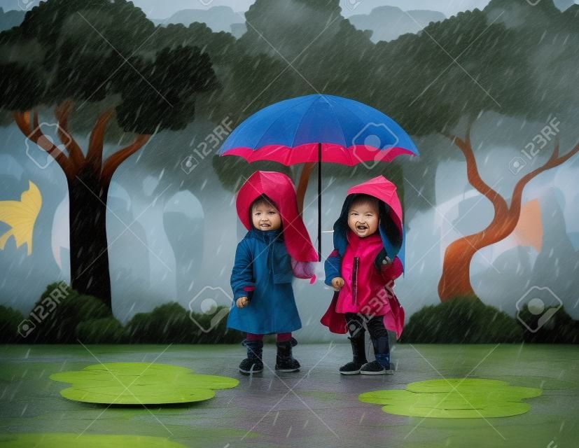 빗속에서 우산을 사용하는 아이들