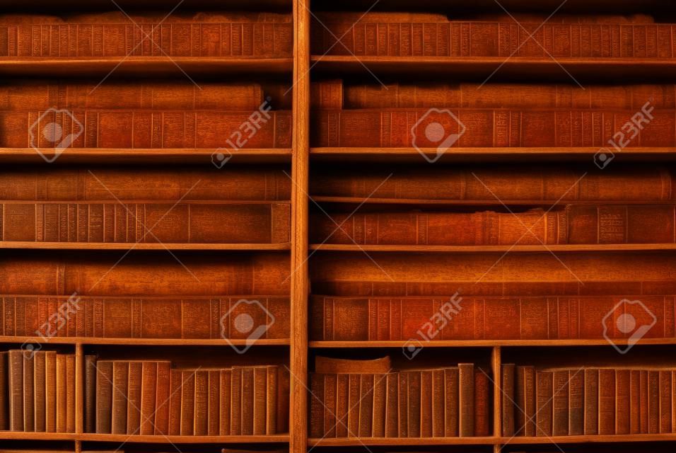 historic old books in ancient library, wooden bookshelf