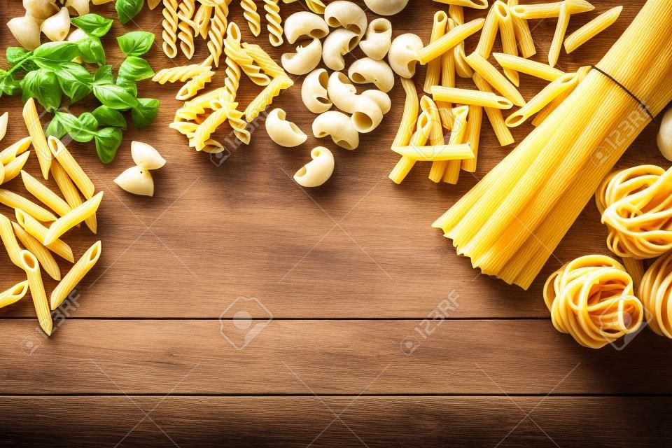 Pasta collection on rustic wooden background
