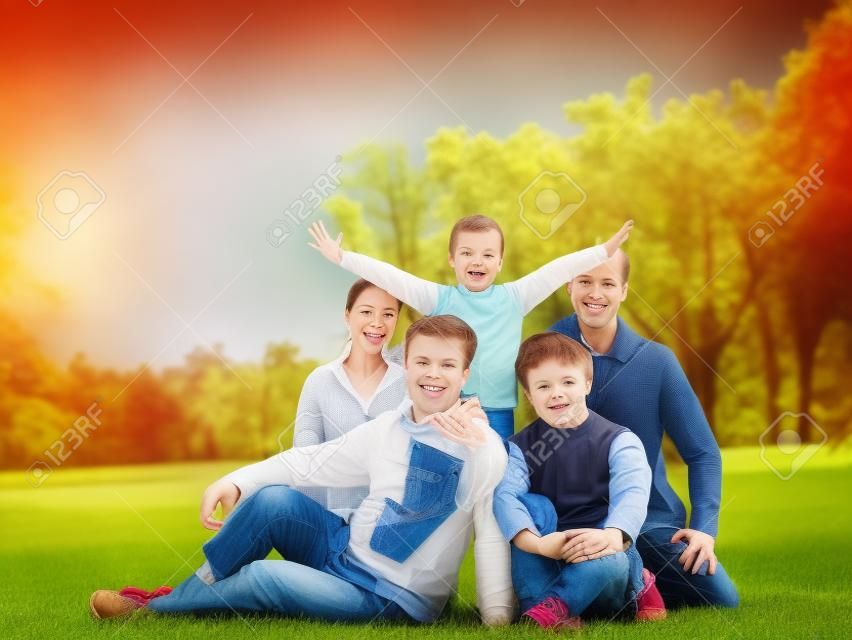 Happy family of five in the park high quality photo