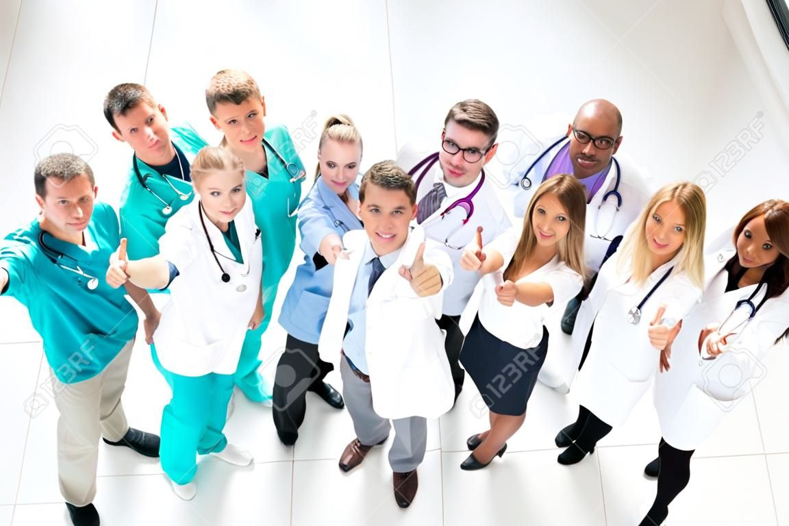 top view. large group of medical professionals pointing at you. photo with copy-space