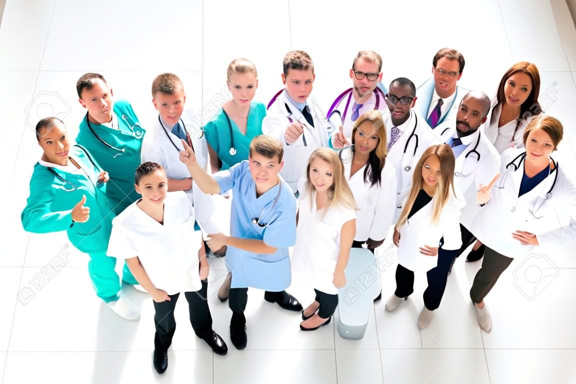top view. large group of medical professionals pointing at you. photo with copy-space