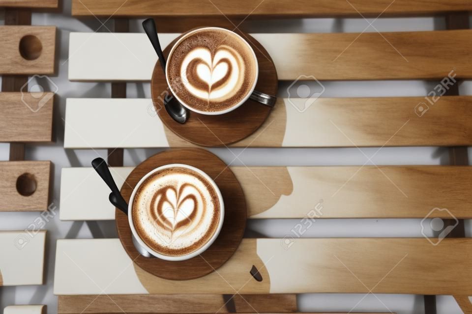 Two cups of cappuccino with latte art
