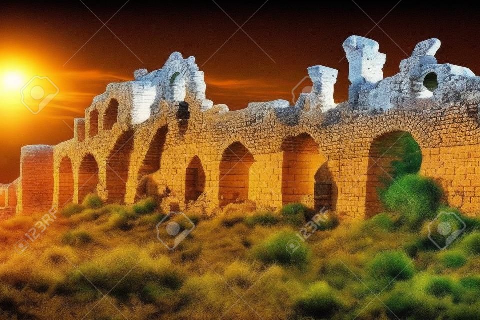 Awesome view of the ancient city walls in Side, Turkey. The amazing ruins are a popular tourist attraction of the world.