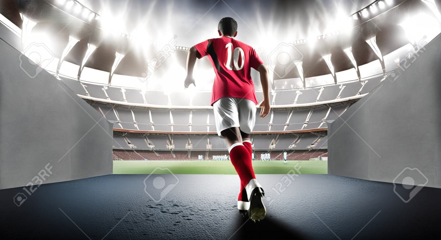 Piłkarz wchodzący na wyimaginowany stadion 3D. Wyimaginowany stadion piłkarski jest modelowany i renderowany.