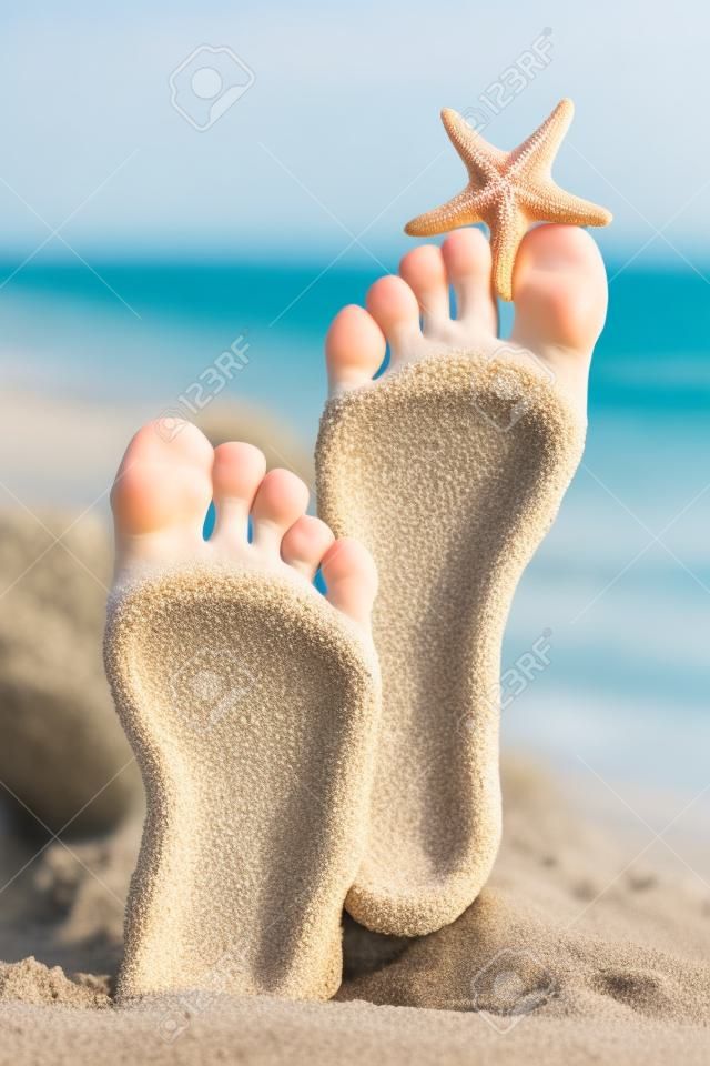 Sandy feet with starfish.