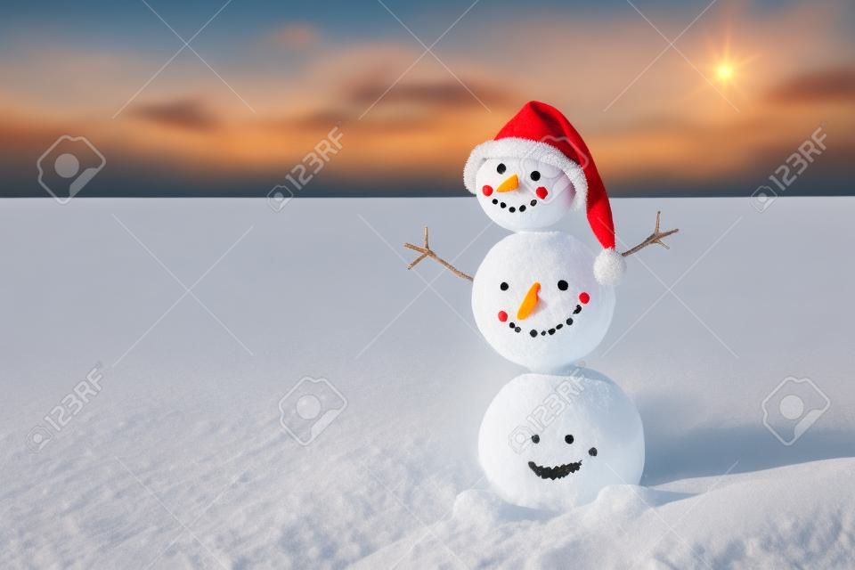 Smiley sandy snowman in santa hat. Holiday concept for New Years and Christmas Cards.