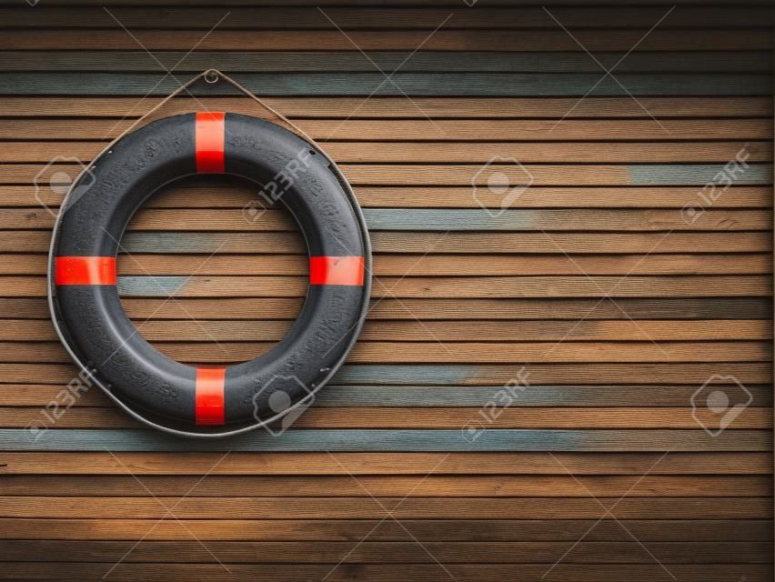 Lifebuoy attached to a wooden wall