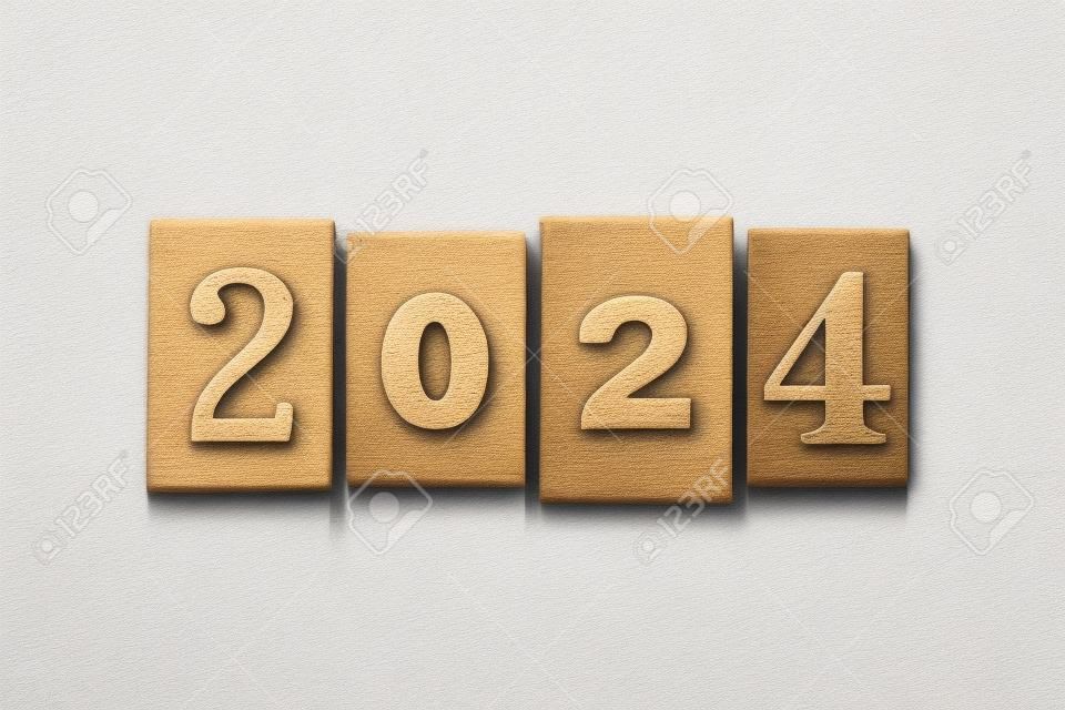 The year 2024 written in old vintage letterpress type isolated on a white background