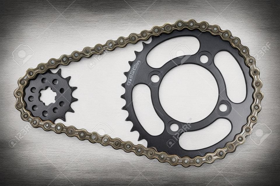 Roller chains with sprockets for motorcycles on white background