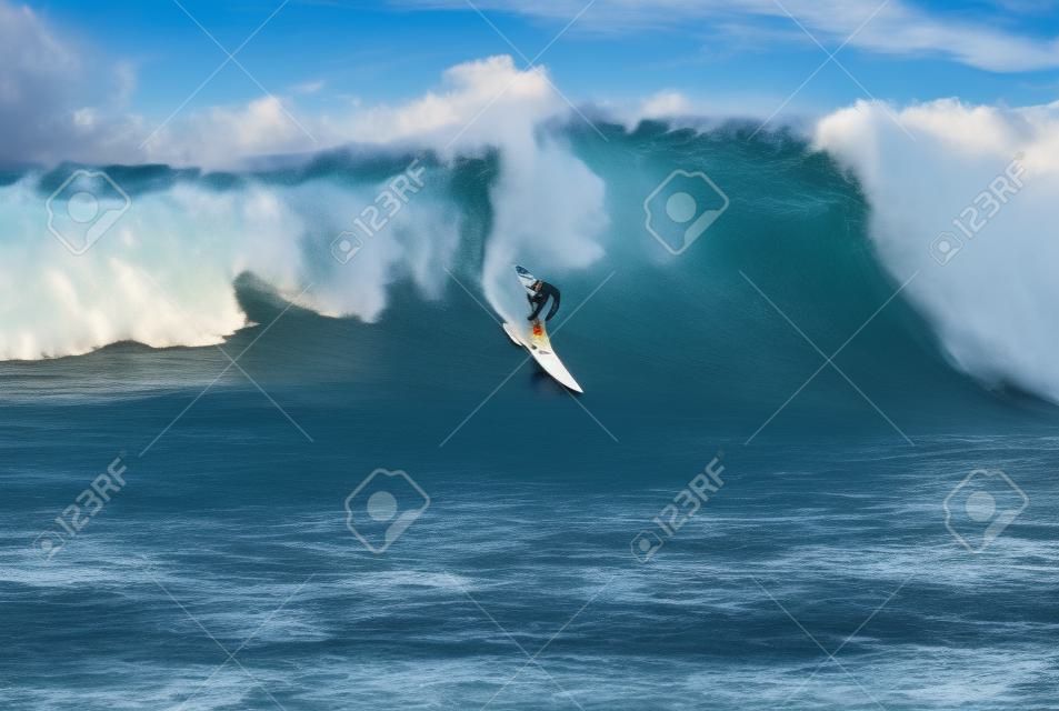 Extreme surfer riding giant ocean wave in Hawaii