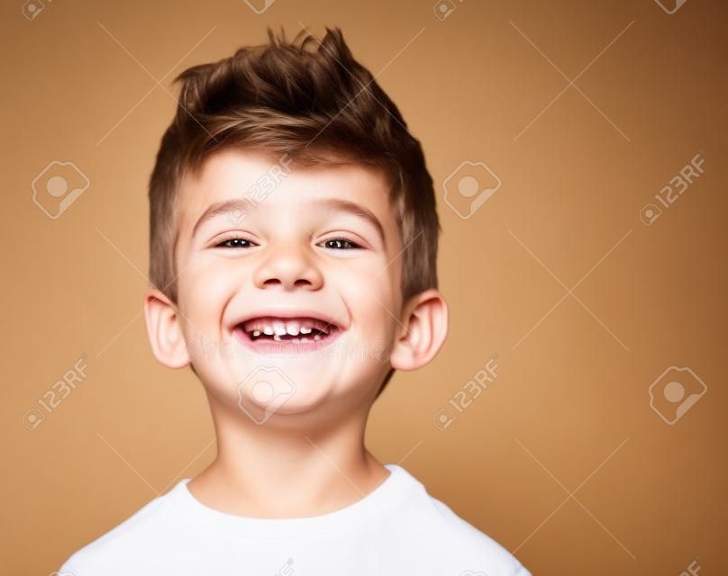 Happy young boy with smile on his face on white