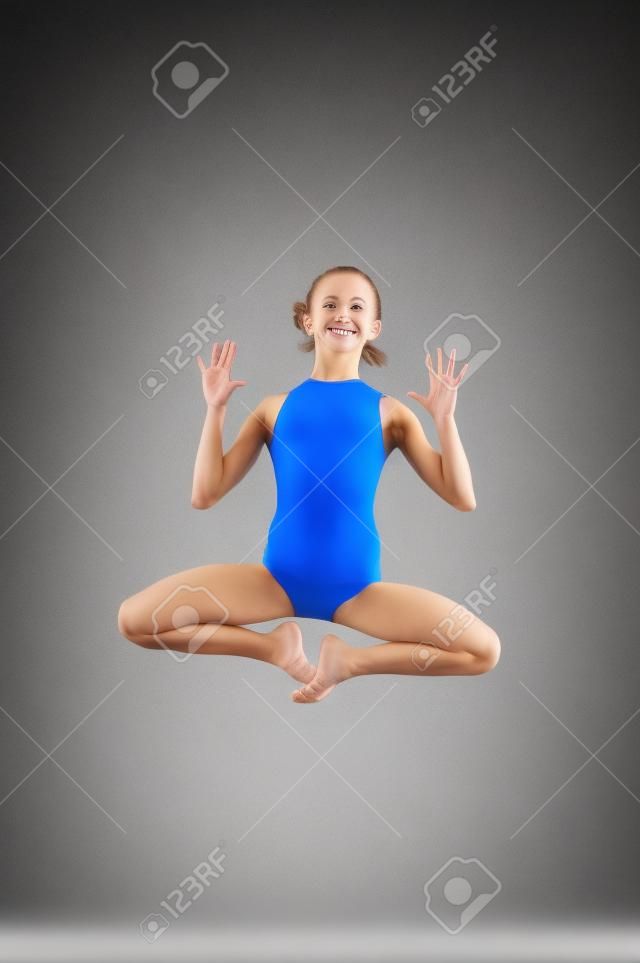 Gymnast girl jumping studio