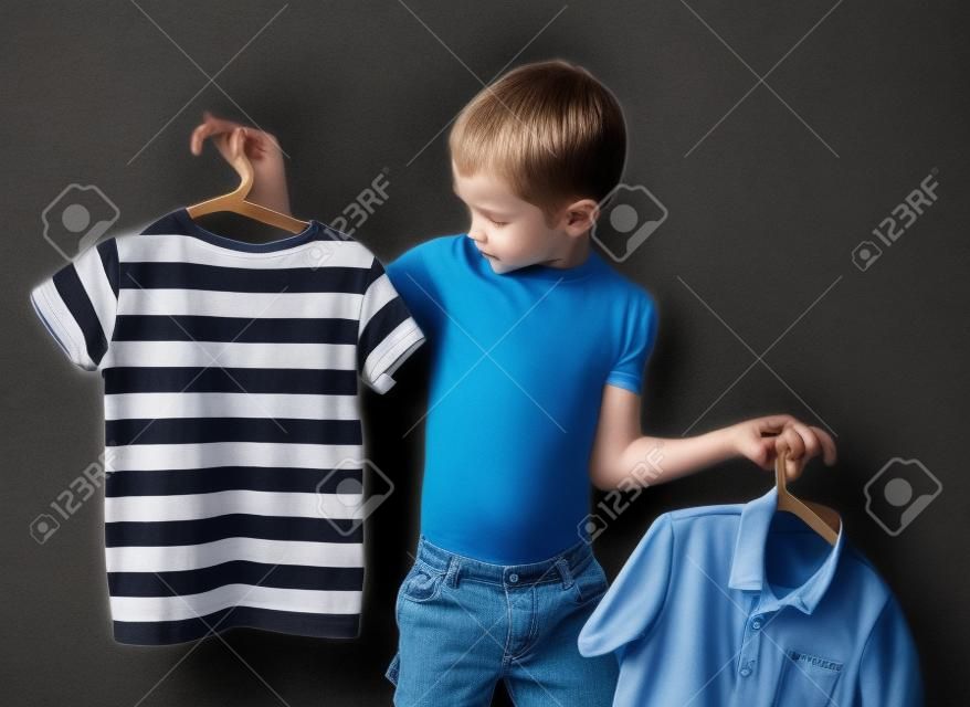 shirt or t-shirt. the boy chooses that to wear a t-shirt or shirt
