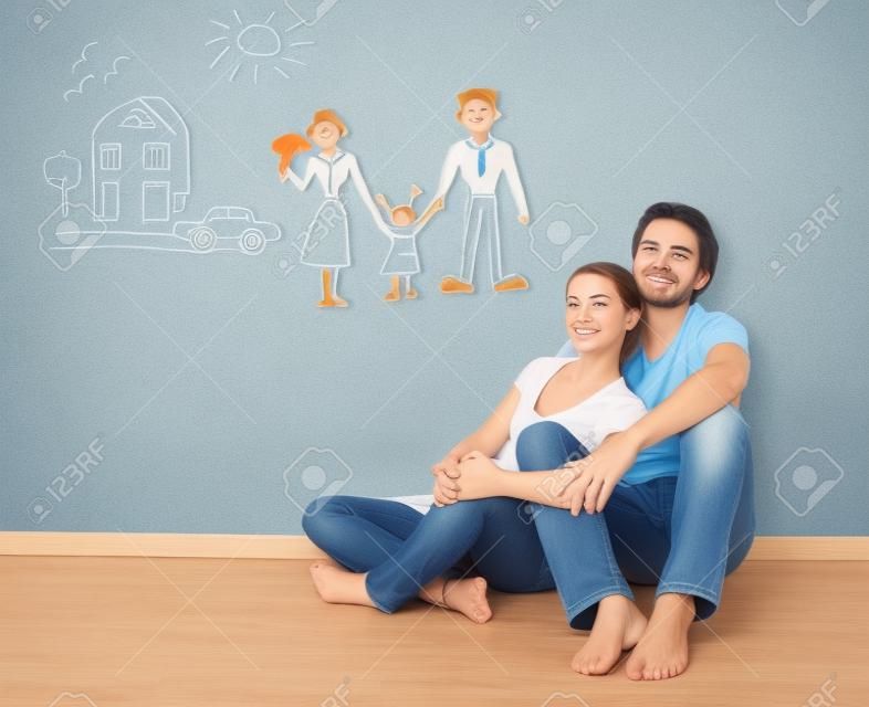 概念。年輕幸福的家庭夫婦做夢的新房子，車子，孩子，財務的福祉