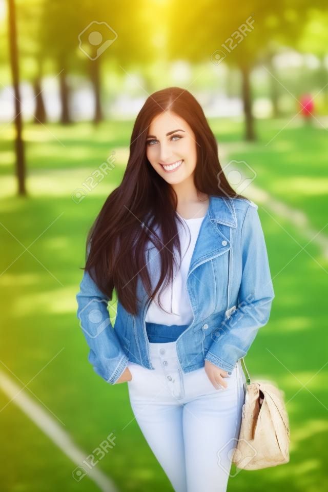 Attractive young woman enjoying her time outside in park