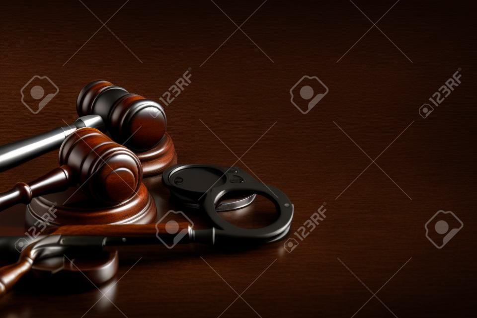 Gun and judges gavel on the table. Crime, robbery, attack concept