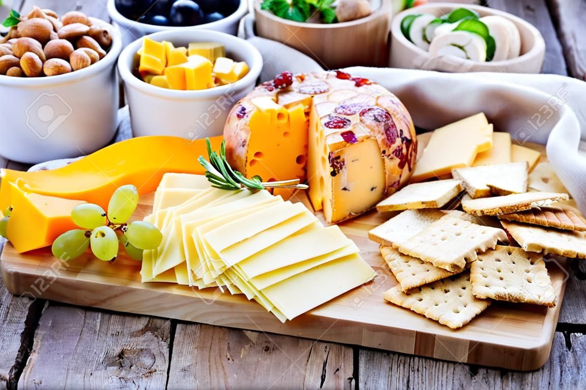 Cheese plate with many foods on a table