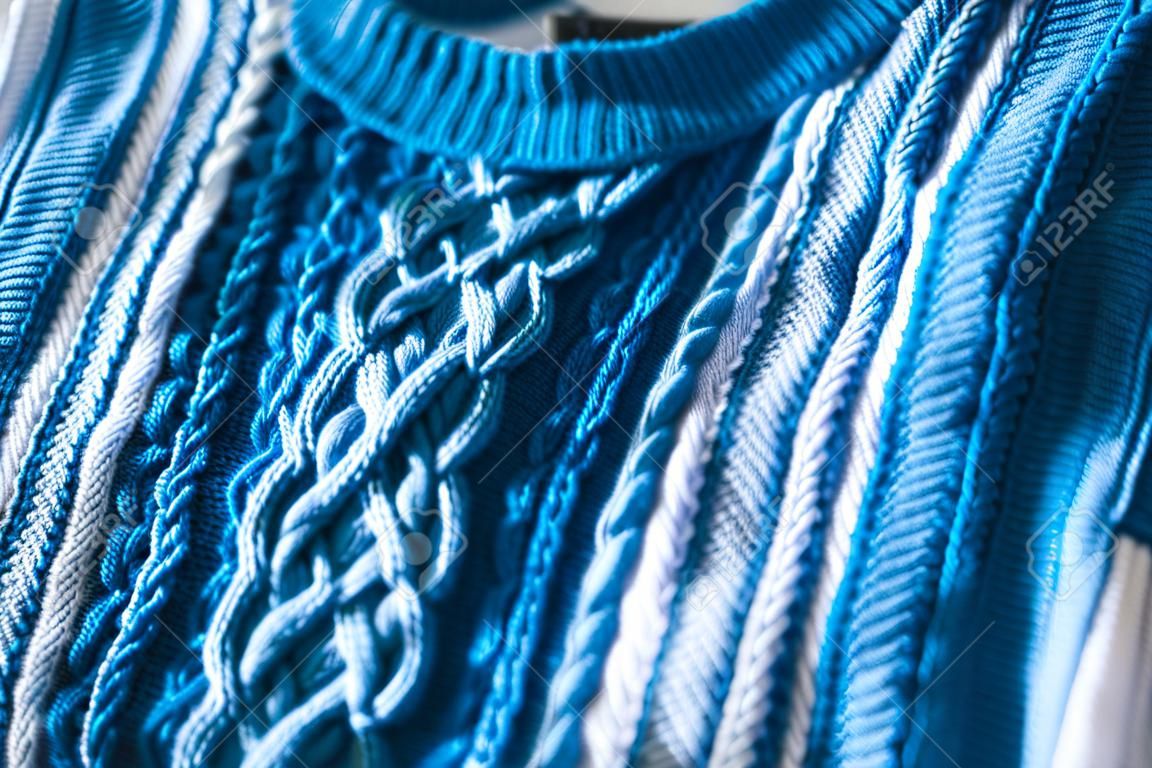 tie dye cable knit jumper close-up, concept of clothes dye and fashion diy