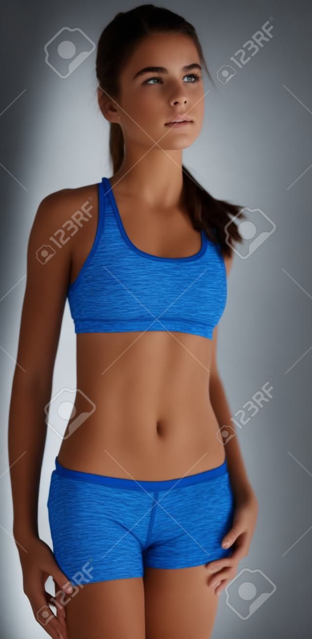 Fit Teen Girl Posing in Sports Bra and Shorts
