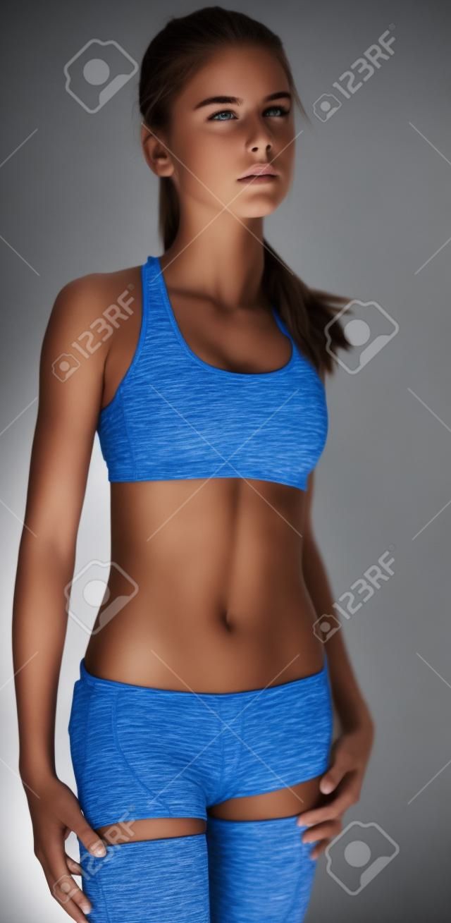 Fit Teen Girl Posing in Sports Bra and Shorts