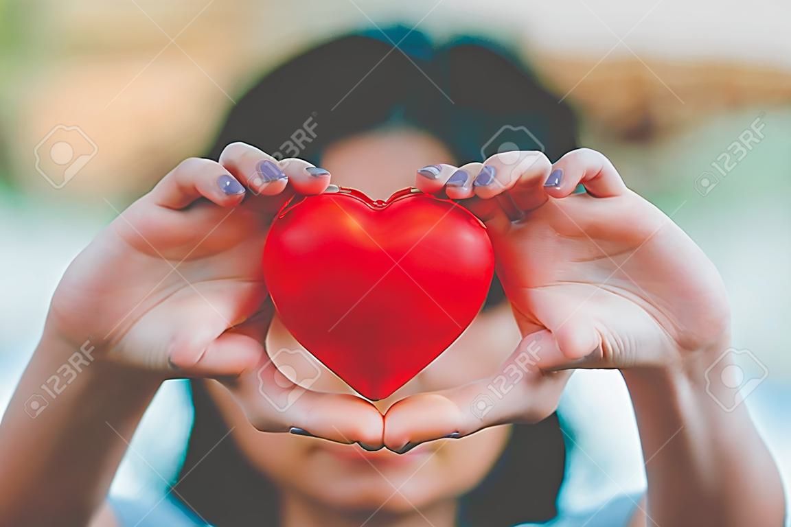 Woman hold red heart use for background