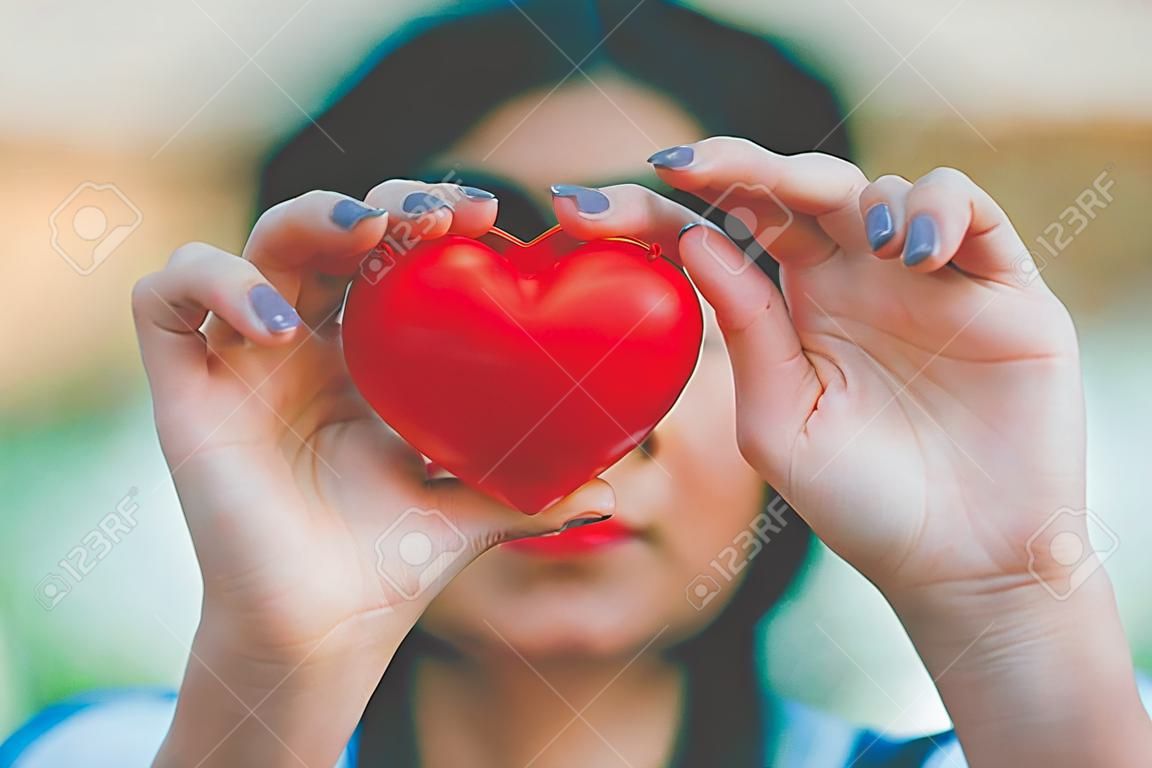 Woman hold red heart use for background