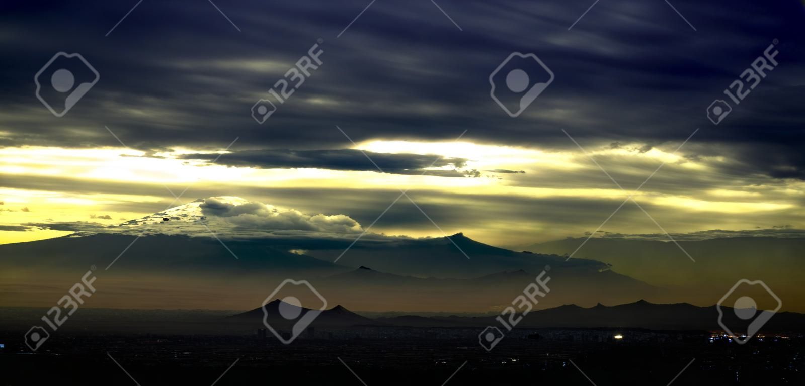 Beautiful sunrise from Mexico City with volcanoes in the landscape