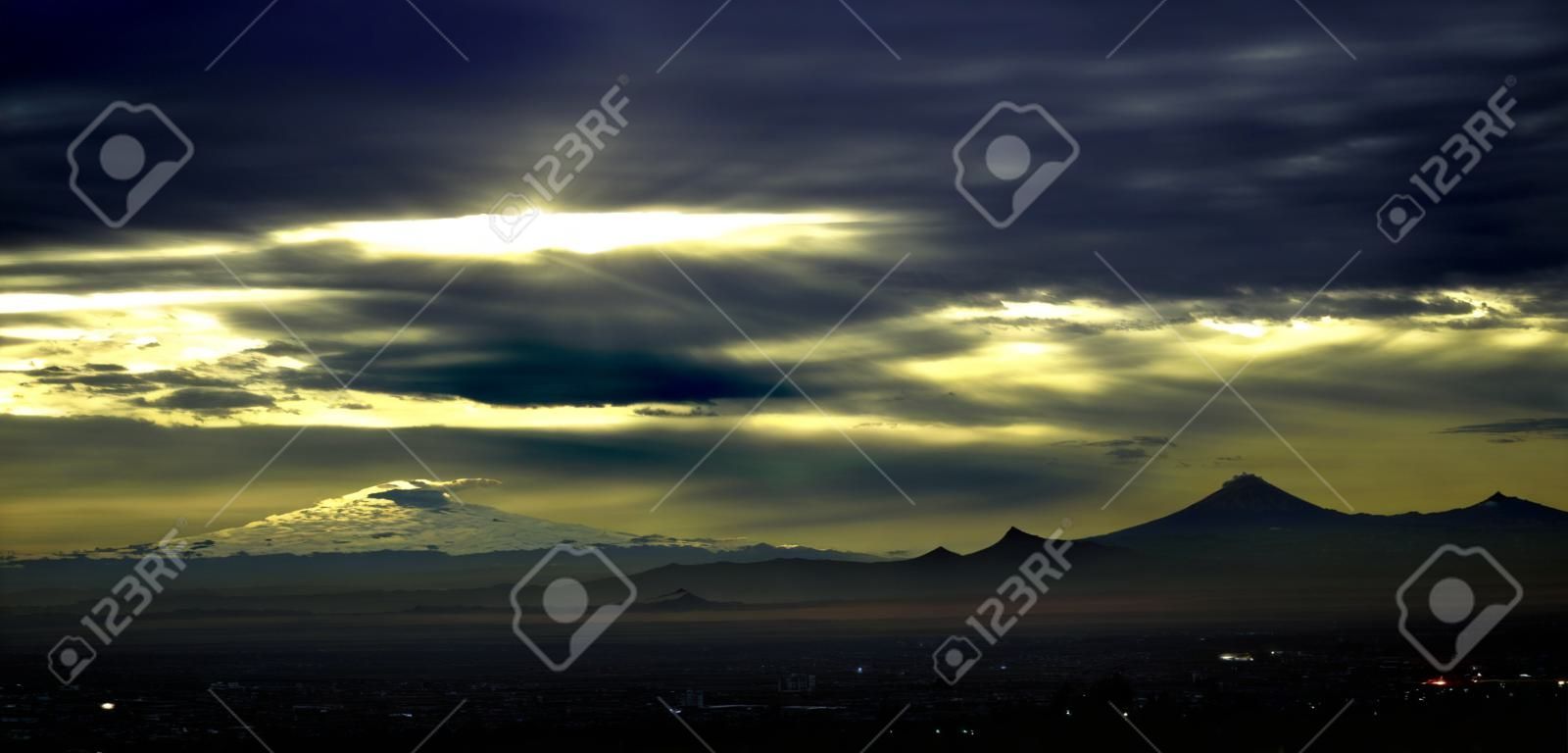 Beautiful sunrise from Mexico City with volcanoes in the landscape