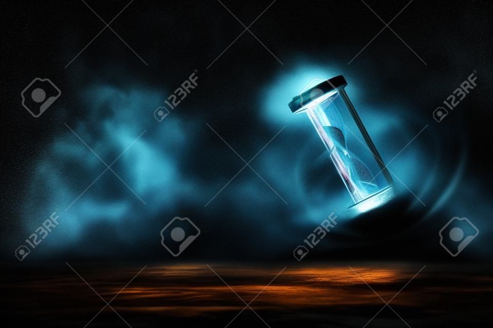 dramatic lit image of hourglass, time concept