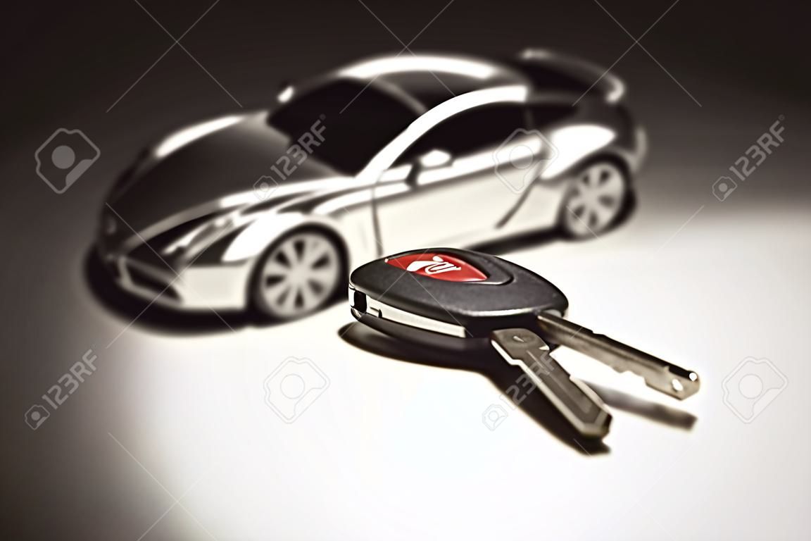 Auto Key, Remote e auto sportive sotto luce Spot.