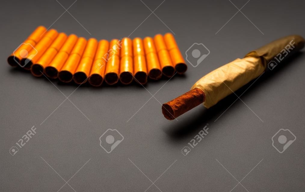Tobacco heating system and a pack of tobacco sticks on a gray background