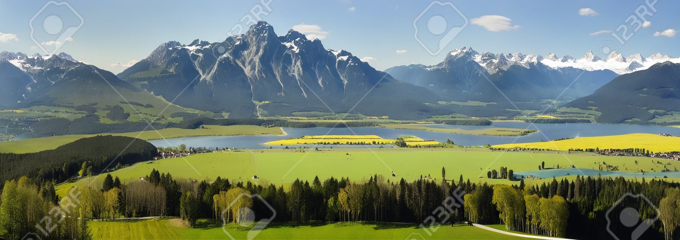 wide angle panorama landscape in Bavaria with lake and alps mountains