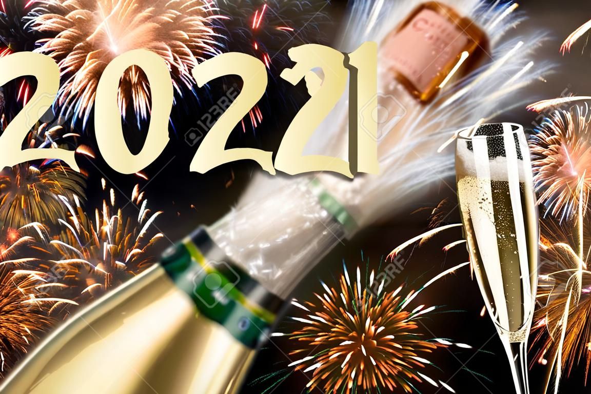 popping bottle of champagne with firework at silvester 2021