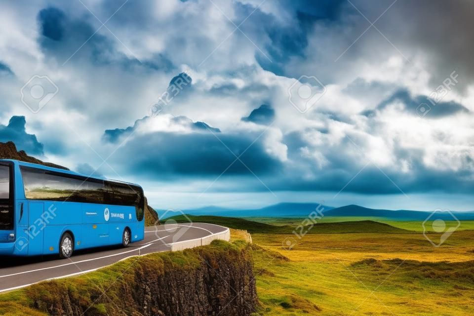 Tourist bus traveling on mountain road. Ring of Kerry, Ireland. Travel destination
