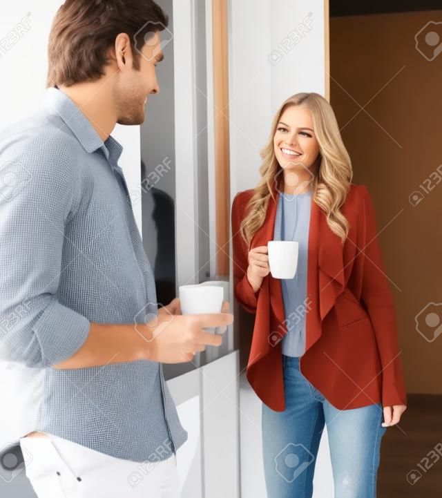 A man and a woman talking in a coffee break