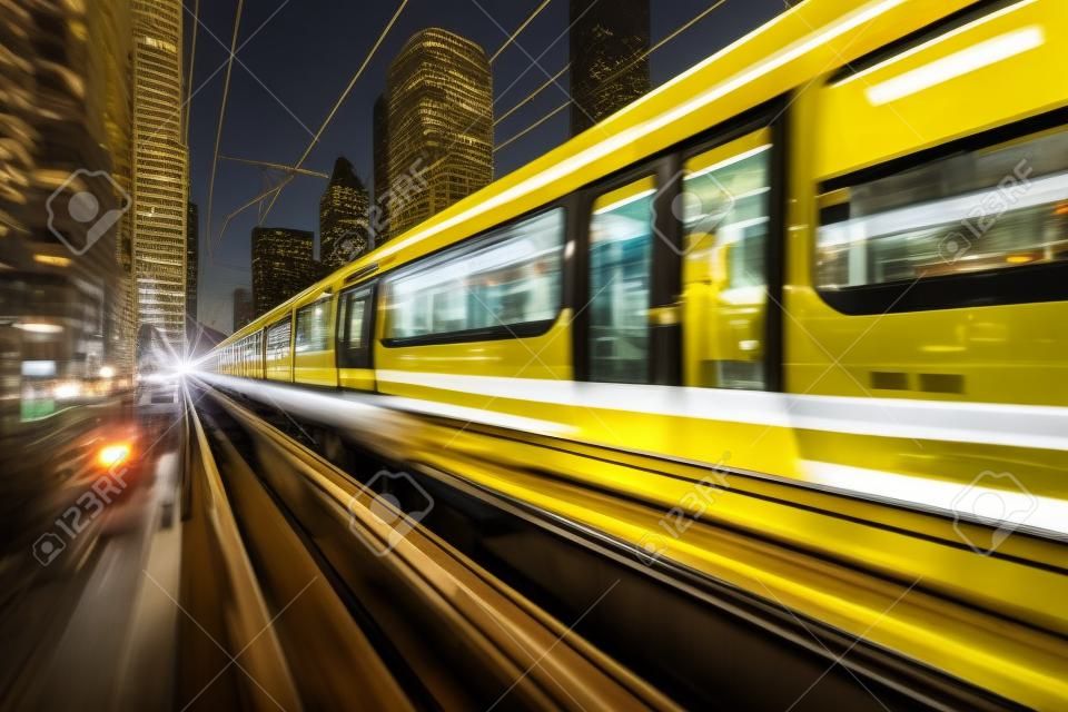A sleek yellow train speeds along the electric railway, surrounded by the bustling blur of the cityscape, embodying the essence of modern urban transportation