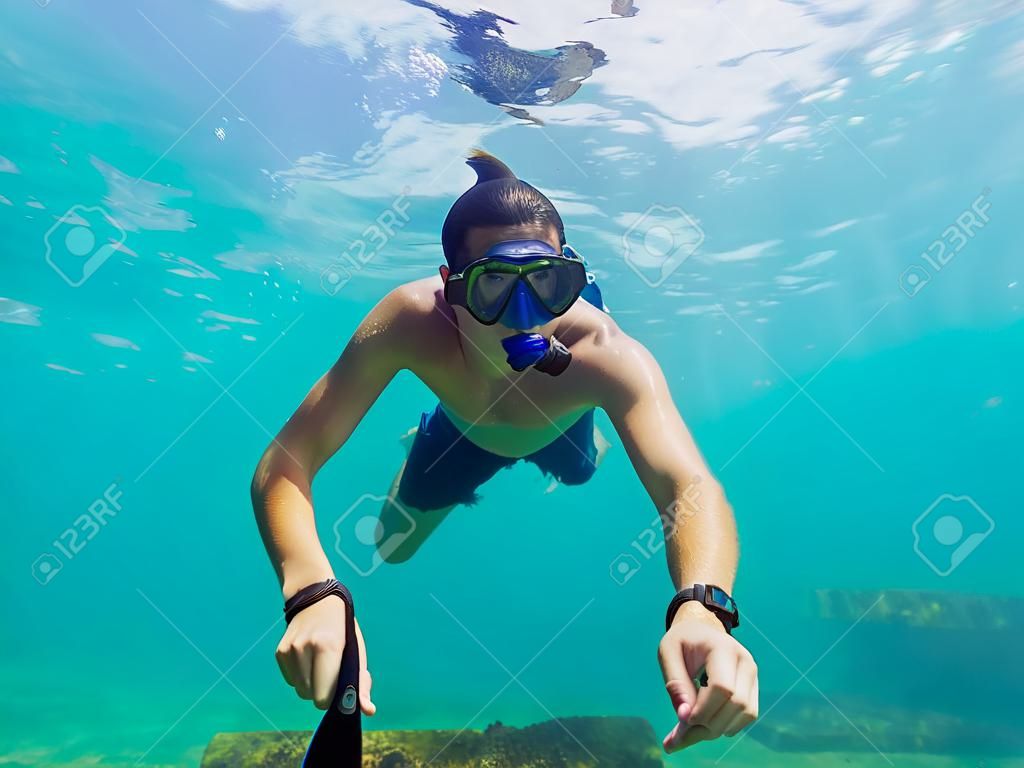 A young caucasian snorkeling man under water selfie Thailand