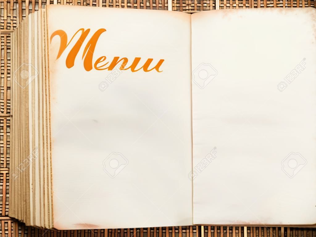 One open blank vintage menu book closeup
