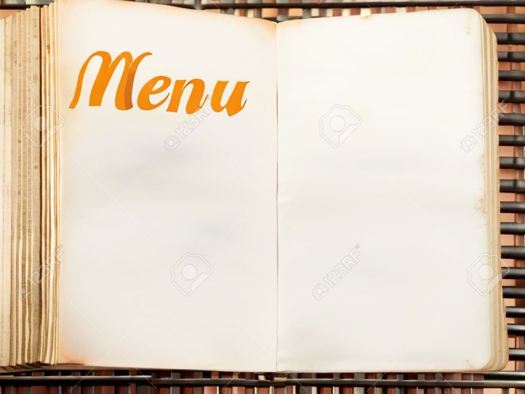 One open blank vintage menu book closeup