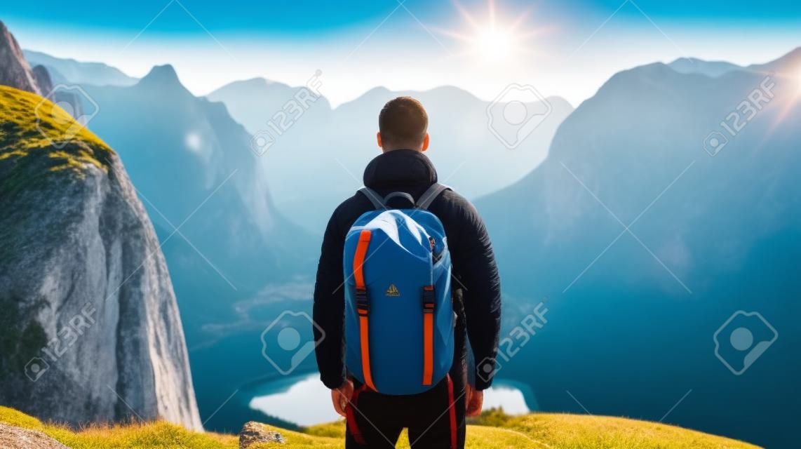 Back View of tourist with backpack on beautiful mountain landscape, Generative AI