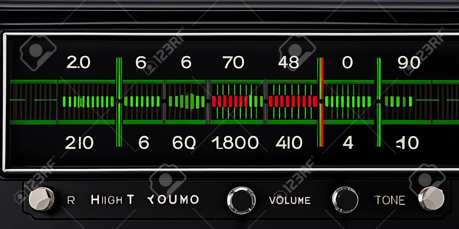 black vintage radio tuner closeup with tone and volume control