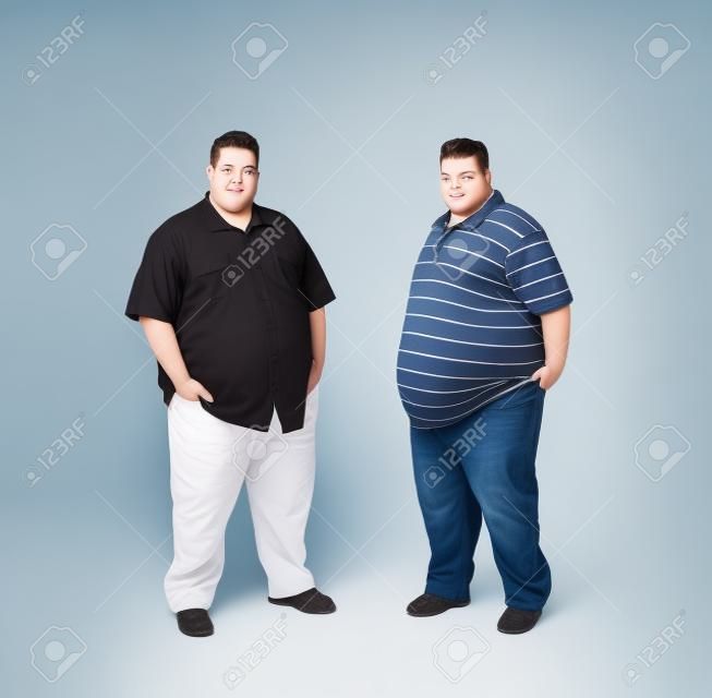 Couple obese twins isolated on white background