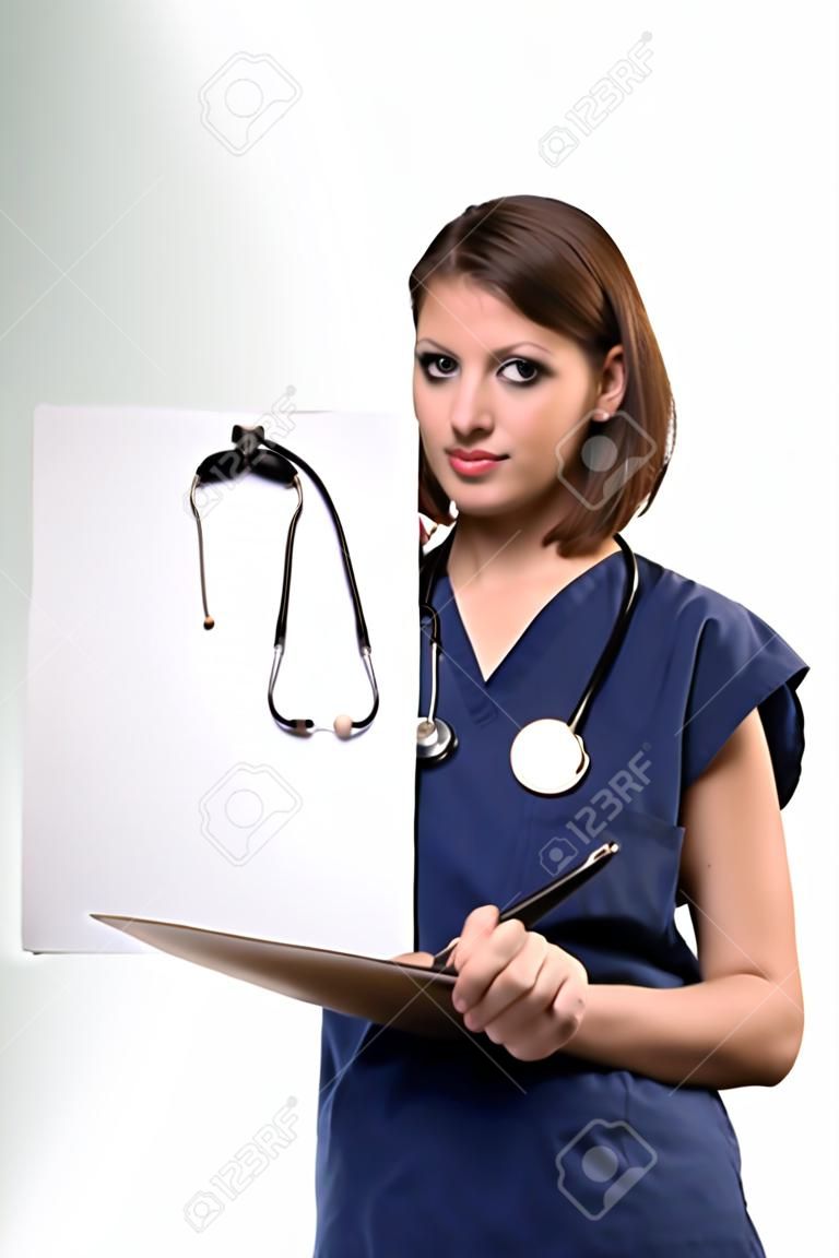 Nurse filling out patient chart standing on white