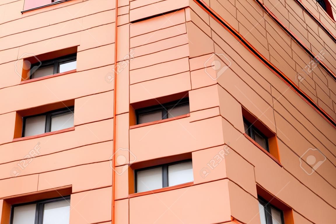 Facade of building with different colors. Black and orange