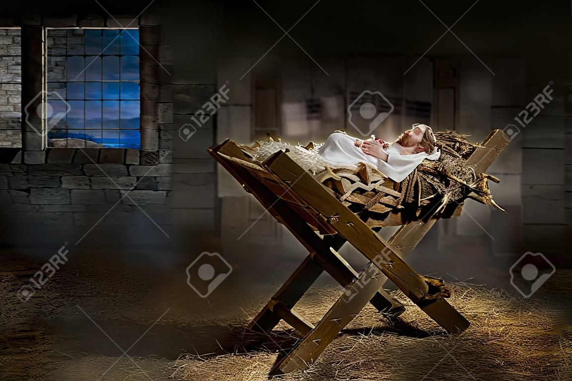 Jesus resting on a manger while light from the star filters into the room