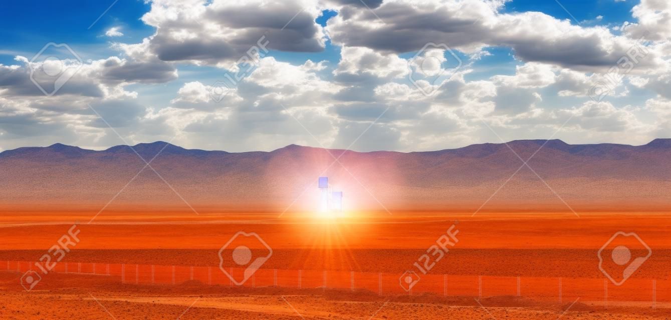 Concentrated solar power plant, CSP. Tower and mirrors, solar thermal energy, Blue sky with clouds, spring day in desert, United States