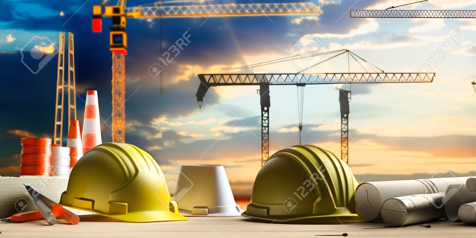 Contractor site office concept. Project construction blueprints and engineering tools on wooden desk, blur construction cranes and sky background. 3d illustration